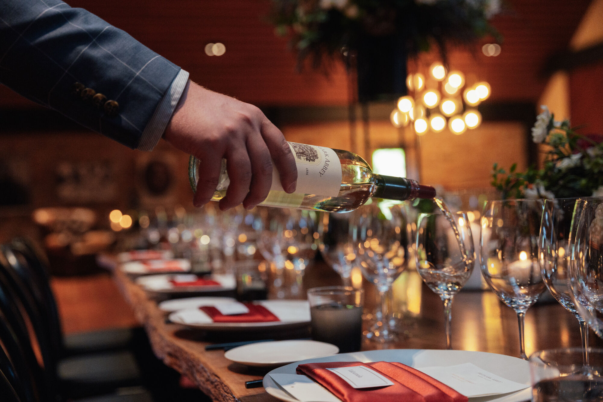Pouring white wine at Freemark Abbey